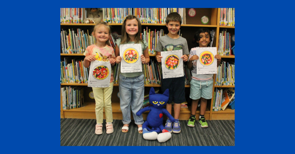 Students holding their assignment with Pete the Cat