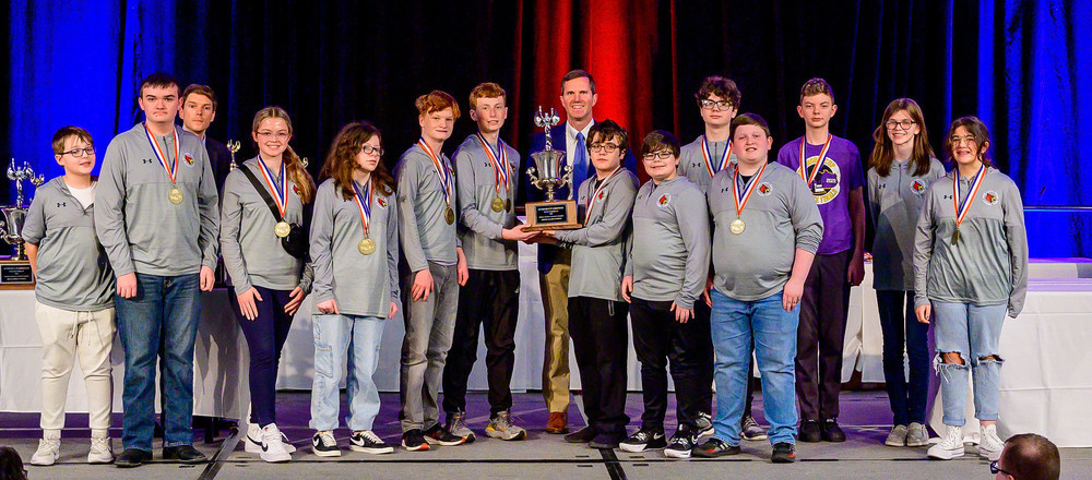 Students posing with Governor and Quick Recall Trophy