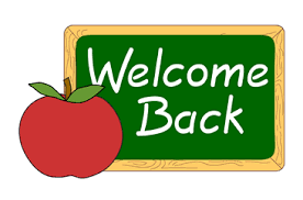 welcome back written on a green chalkboard with a red apple
